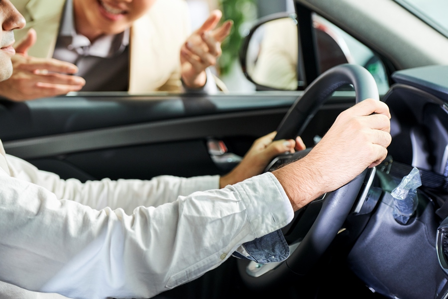 young man driving a new car 5A9G2NW young man driving a new car 5A9G2NW